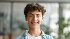 teen on his first day with braces